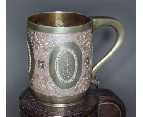 A Victorian bright cut engraved silver tankard, gilt interior, George Fox, London 1871, height 8.5cm, wt. 5ozt, with case.&nb