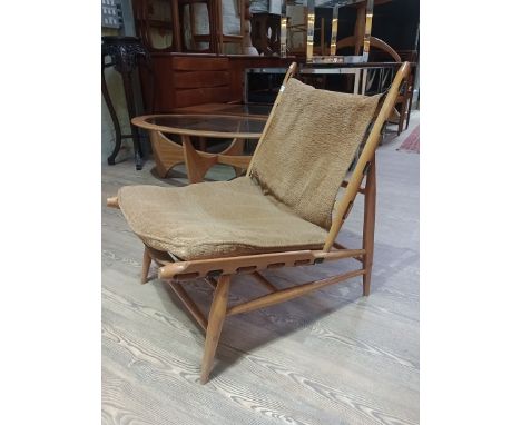 A vintage Ercol beech lounge chair, model number 427. Condition- frame is good and sturdy, some fading, webbing is stretched,