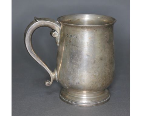 A George V silver tankard with scroll handle, Adie Brothers, Birmingham 1928, height 12.5cm, wt. 11 1/2ozt.&nbsp;Condition - 