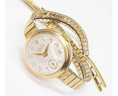 A ladies 9ct gold Enicar wristwatch, case diameter 22mm, signed champagne dial, seconds subsidiary, 15 jewel manual wind move