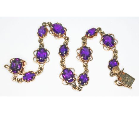 A hallmarked 9ct gold amethyst bracelet, length 18cm, gross wt. 10.6g.&nbsp;Condition - good, appears damage/repair free, cla