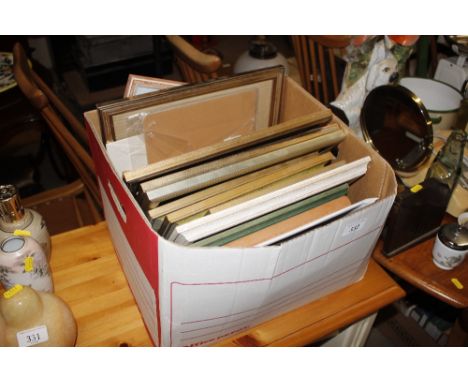 A box of various pictures prints and frames 