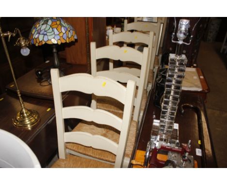 Six cream painted ladder back rush seated chairs 