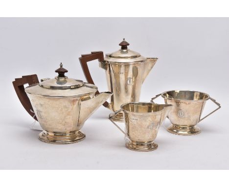 A FOUR PIECE SILVER TEA SERVICE SET, comprising teapot and coffee pot, each fitted with brown wooden handles, a cream jug and