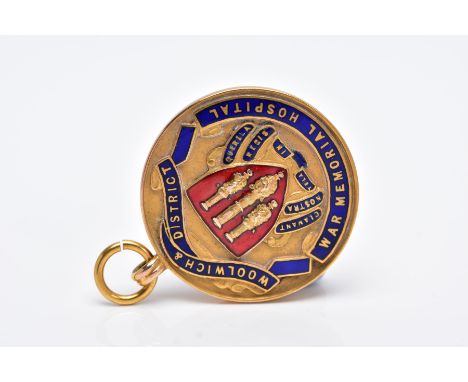 A 9CT GOLD ENAMELLED FOB MEDAL, of a circular form, decorated with blue and red enamel, for 'Woolwich &amp; District, War Mem