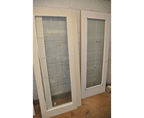 A COLLECTION OF SEVEN INTERIOR DOORS to include two cream with a single glaze panel, width 74.5 (beading come apart from one)