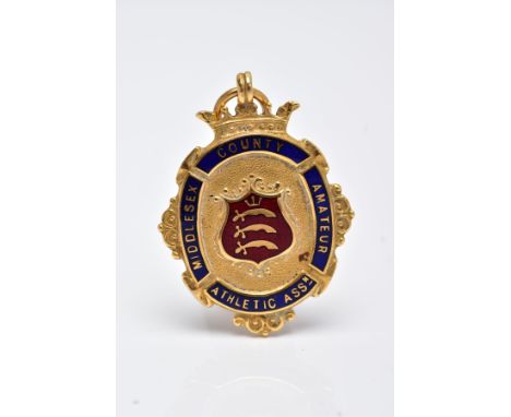 A 9CT GOLD ENAMELLED FOB MEDAL, of an oval form decorated with red and blue enamel for 'Middlesex County Amateur Athletic Ass