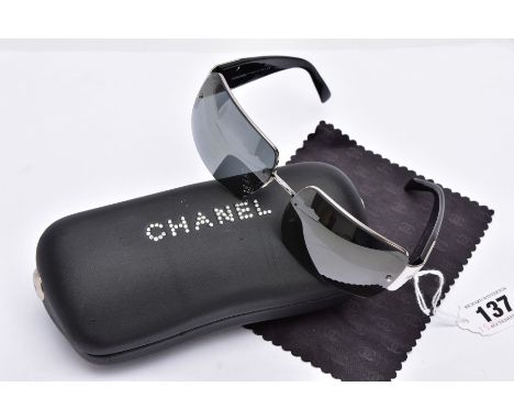 A PAIR OF LADIES CHANEL SUNGLASSES, black tinted lenses, signed in the top corner 'Chanel', black arms with colourless paste 