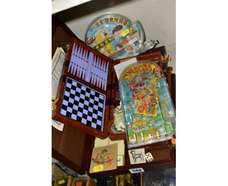 A CASED RUMMY POKER AND OTHER GAMES SET, contents not checked, with a cased magnetic travel games compendium, contents not ch