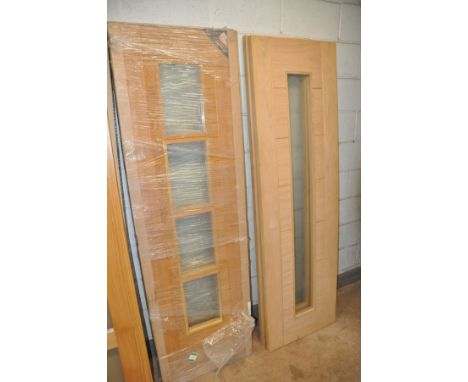 A COLLECTION OF INTERIOR DOORS to include two oak with a single long glaze width 61cm, two oak with four glazed panels width 