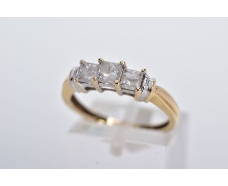 A 14CT GOLD THREE STONE DIAMOND RING, designed with a row of three claw set princess cut diamonds, total estimated diamond we