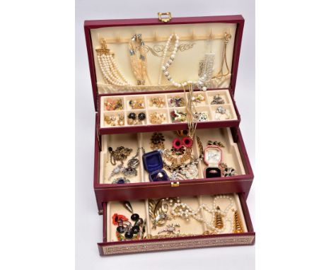 A BURGUNDY JEWELLERY BOX WITH COSTUME JEWELLERY, box opens to reveal three tiers filled with mainly costume jewellery, to inc