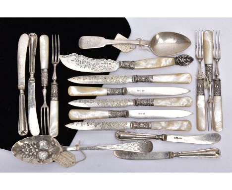 A SELECTION OF SILVER SPOONS AND SILVER MOUNTED CUTLERY, to include a George III silver serving spoon with an embossed fruit 