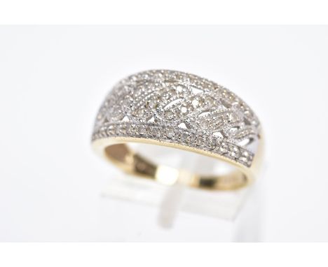 A 9CT GOLD DIAMOND RING, a wide openwork ring set with single cut diamond detailing, stamped diamond weight 0.33cts, hallmark