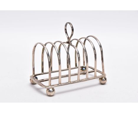 A SILVER GEO. V TOAST RACK, of a plain polished design, loop handle, raised on four ball feet, hallmarked Sheffield 1910 'mar