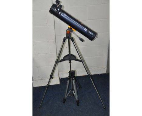 A CELESTRON ASTROMASTER LT76AZ TELESCOPE with two eye pieces, on a folding tripod, together with a Bilora adjustable tripod c