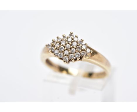 A 9CT GOLD CUBIC ZIRCONIA RING, of a lozenge shape set with circular cut colourless cubic zirconia  stones, hallmarked 9ct go