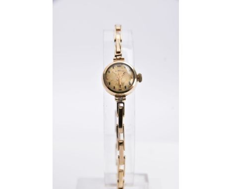 A LADIES 9CT GOLD WRISTWATCH, round gold dial, possibly signed 'Shield' but with letters missing, baton markers, gold tone ha