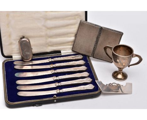 A SELECTION OF SILVER ITEMS, to include a small trophy with plain design, approximately 77mm in height, hallmarked rubbed, a 