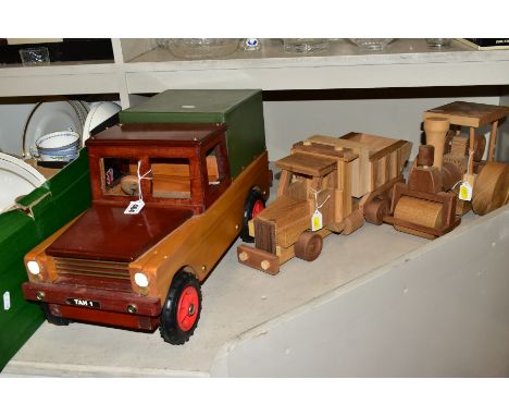 THREE WOODEN TOYS, comprising Land Rover length 51cm x height 27cm, a steam roller length 26cm x height 21cm and a dump truck