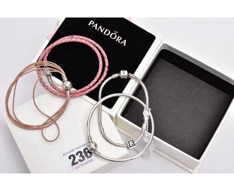 FOUR PANDORA CHARM BRACELETS, to include a snake bracelet fitted with a triangular charm with the initial 'F' fitted with a s