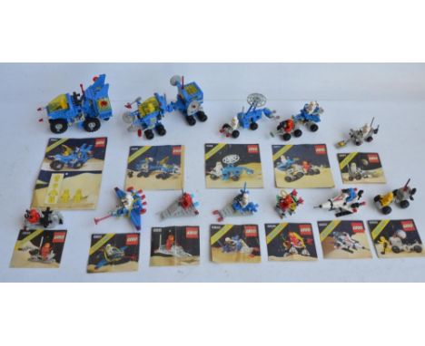 Twelve vintage unboxed and previously used though complete Lego/Legoland Space sets to include 885, 6803, 6806, 6820, 6821, 6