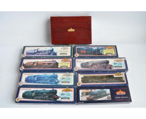 Nine boxed OO gauge electric steam train models from Bachmann to include limited edition Green Arrow in wooden presentation b