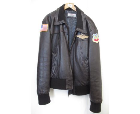 Leather bomber jacket (XL) with Air Combat Command patch to left arm, U.S. Air Force badge to left side and American flag pat