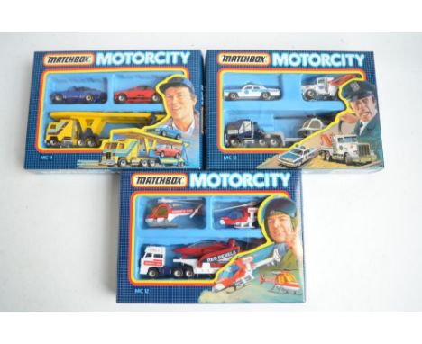 Three boxed Matchbox MotorCity multi model sets MC11,12 and 13, models in mint condition, boxes at least near mint 