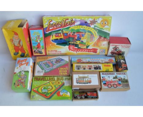 Collection of modern tin plate clockwork and lever action models and similar toys to include a charming Panda Drummer by Amus