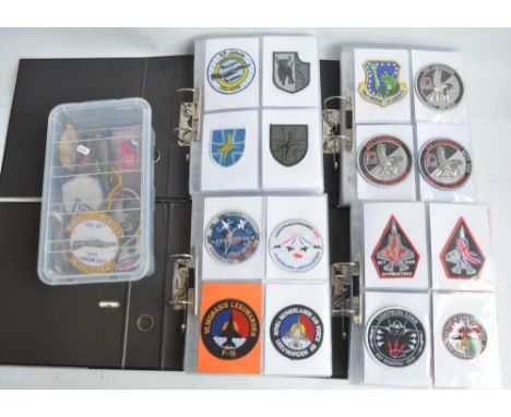 Four A4 sized ring binders and a plastic tub containing a superb and varied collection of unit, squadron and detachment cloth