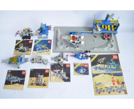 Seven vintage unboxed Lego/Legoland Space sets to include large set 6970 base with moon surface sections, also sets 891, 894,