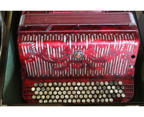 C20th Ca Scandalli Italia, piano accordian, in marbleised red case with mother of pearl button keys in original case, retaile