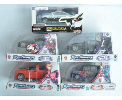 Four Hasbro 1/24th scale Transformers Alternators car themed models, all unopened/factory sealed to include Scion xB Autobot 
