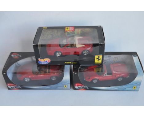 Three 1/18th scale diecast Ferrari model cars from Hot Wheels to include F355 Spider, Dino 246GTS and 550 Barchetta Pininfari