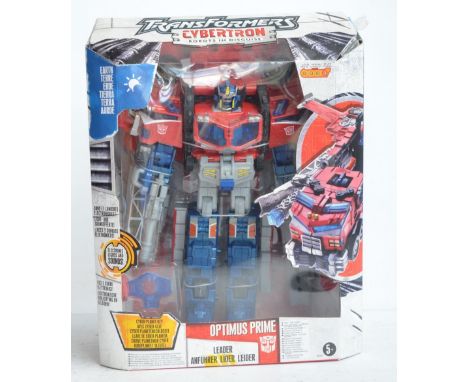 Large 11" Hasbro key activated Cybertron Leader Class Optimus Prime, box appears unopened, model in mint condition and still 