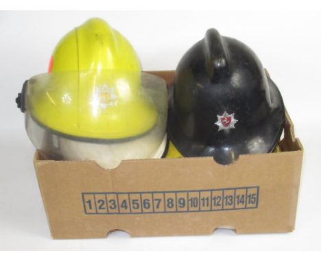 Five British vintage firefighter helmets of various styles and eras, including a c1940s Northumberland Fire Service National 