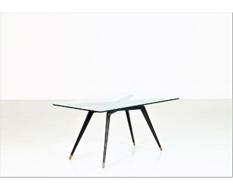 ITALIAN MANUFACTURE Coffee table. Wood, brass and glass. Cm 100,00 x 49,50 x 60,00. Base in lacquered wood, brass tips and gl