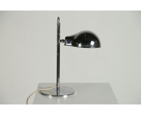 Table lamp . Chromed metal. Cm 17,00 x 43,00. Adjustable table lamp in chromed metal, 70s. Working.