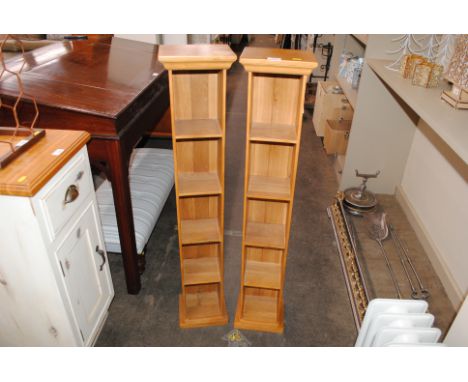 A pair of pine narrow shelf units, 22cm wide x 116cm high