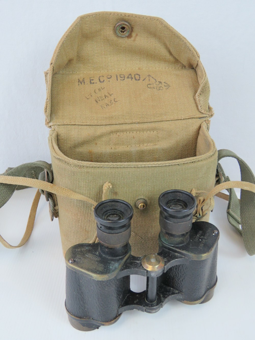 A pair of WWII British military issue binoculars in original case