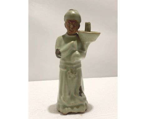 A Chinese Yuan Style Longquan Celadon Figural Oil Lamp, H. 21.5 cm Condition: Minor chips to edge THIS ITEM IS BEING OFFERED 