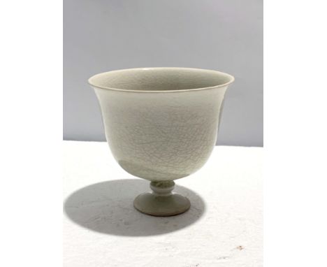 A Chinese White Glazed Cup, Probably Sui, D. 10.2 cm, H. 10 cm Provenance: Estate of the Lam's family from Hong Kong Conditio