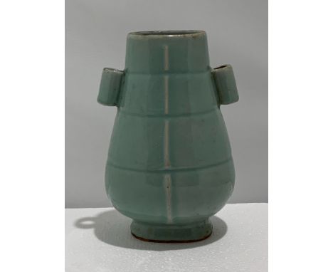 A Chinese Longquan celadon handled vase, Song or later, H. 21.5 cm Provenance: Private collection British Columbia, Canada Co