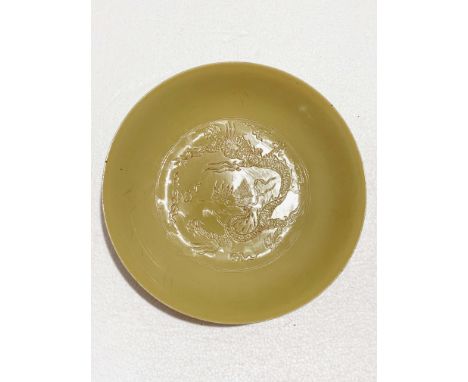 A Chinese Yellow Glazed Dragon Dish, D. 21.6 cm, H. 4.3 cm Provenance: Estate of the Lam's family from Hong Kong Condition: M