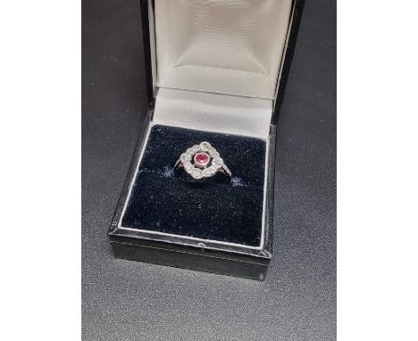 An Art Deco ruby and diamond ring, size J 1/2. 