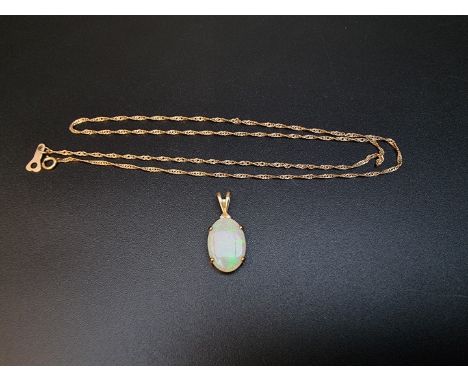A yellow metal opal pendant,&nbsp;stamped 14k/585, 24mm including bale, on 9ct gold chain, 47cm, 1.2g. 