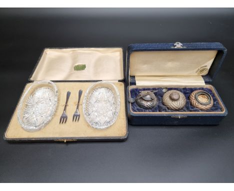 A cased Japanese white metal three piece cruet set, stamped 'Sterling', the case marked Asahi Shoten Yokohama Kobe; together 