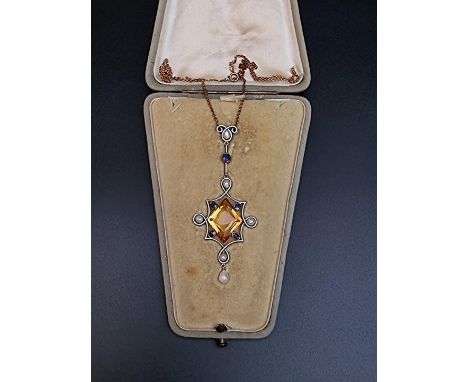 A yellow metal and white enamel pendant, set central star shaped faceted citrine with sapphires and baroque pearls, 77mm high