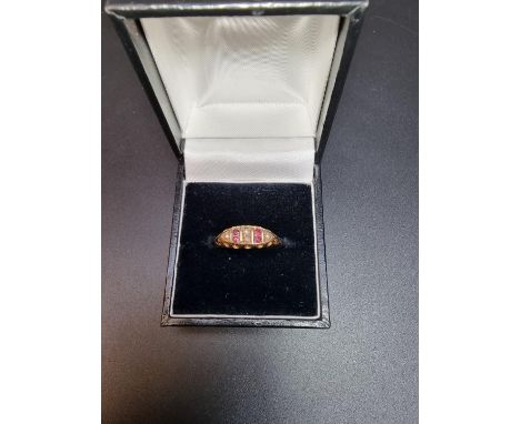 An 18ct gold ruby and seed pearl ring, size Q. 